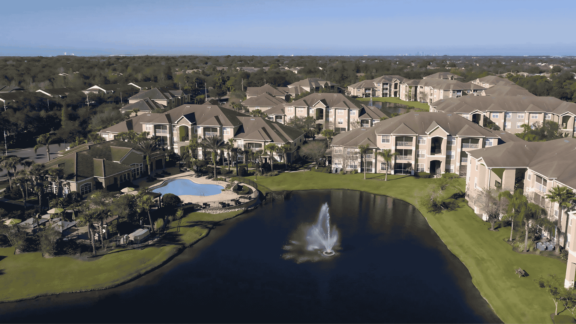 Overhead shot of a Brandon residential community with a central fountain, part of Air Titans’s coverage