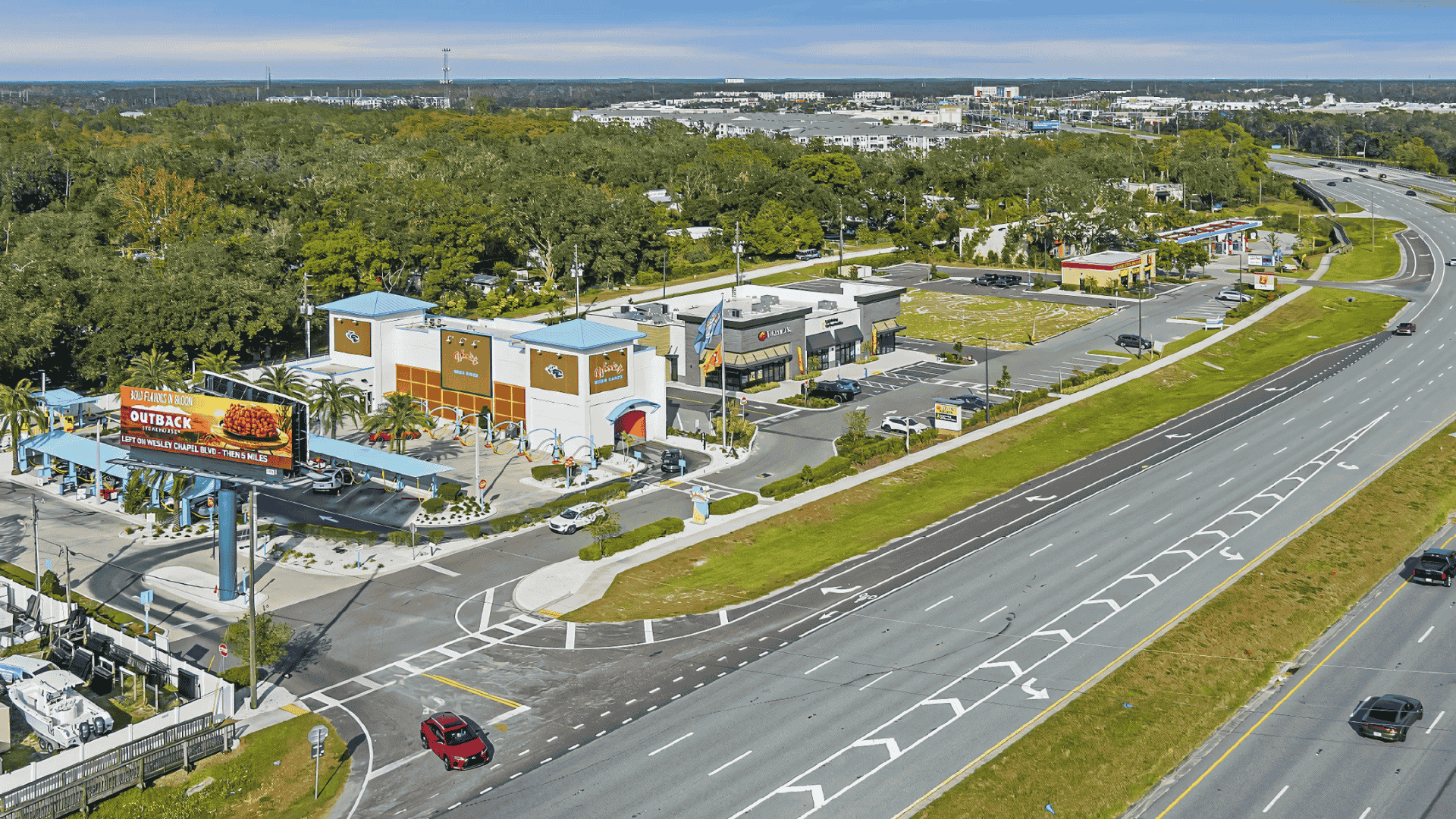 High-angle view of Lutz commercial strip and highway, within Air Titans’s service territory