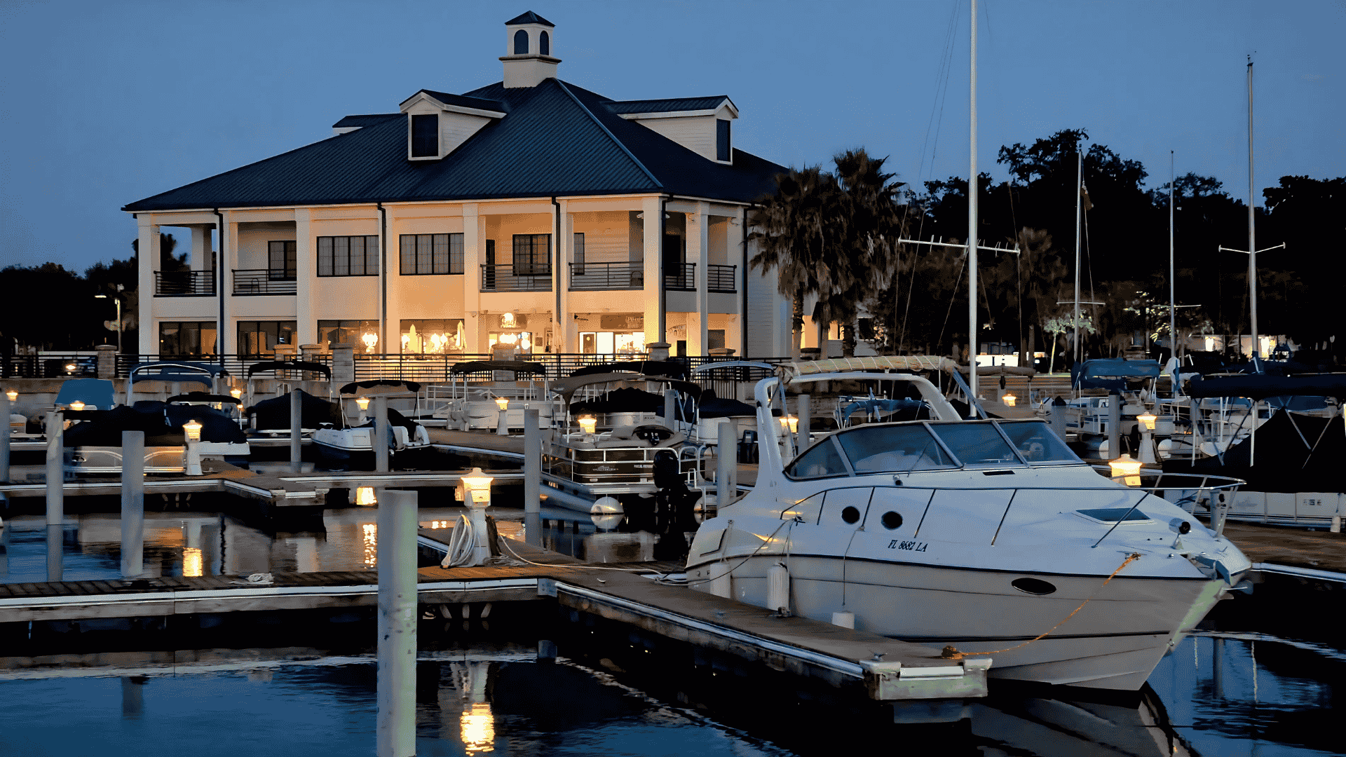 Evening marina scene with boats docked in St. Cloud, one of Air Titans’s service regions