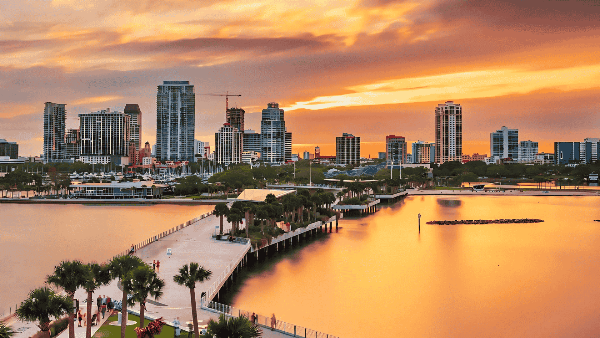 Aerial view of St. Petersburg’s waterfront skyline at sunset, one of Air Titans’s service areas