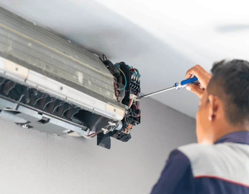 Air Titans technician performing AC repair St. Petersburg FL