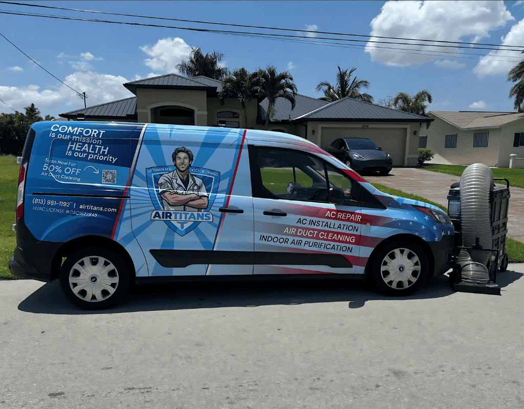 Air Titans service van parked outside a Kissimmee home alongside duct cleaning equipment