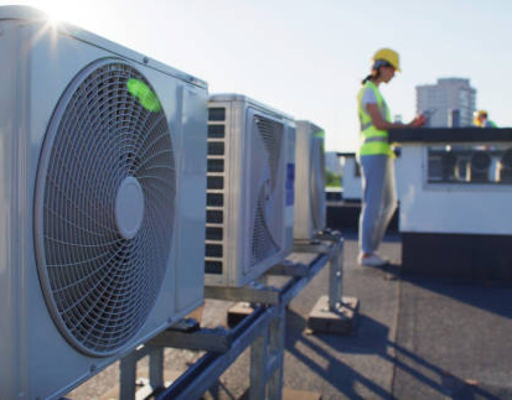 Air Titans technician repairing air conditioner in Lutz, FL home